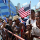 Hundreds of Cubans and visitors from other countries gather across the street from the newly reopened U.S. Embassy to observe the flag-raising ceremony Aug. 14, 2015, in Havana.
Chip Somodevilla/Getty Images